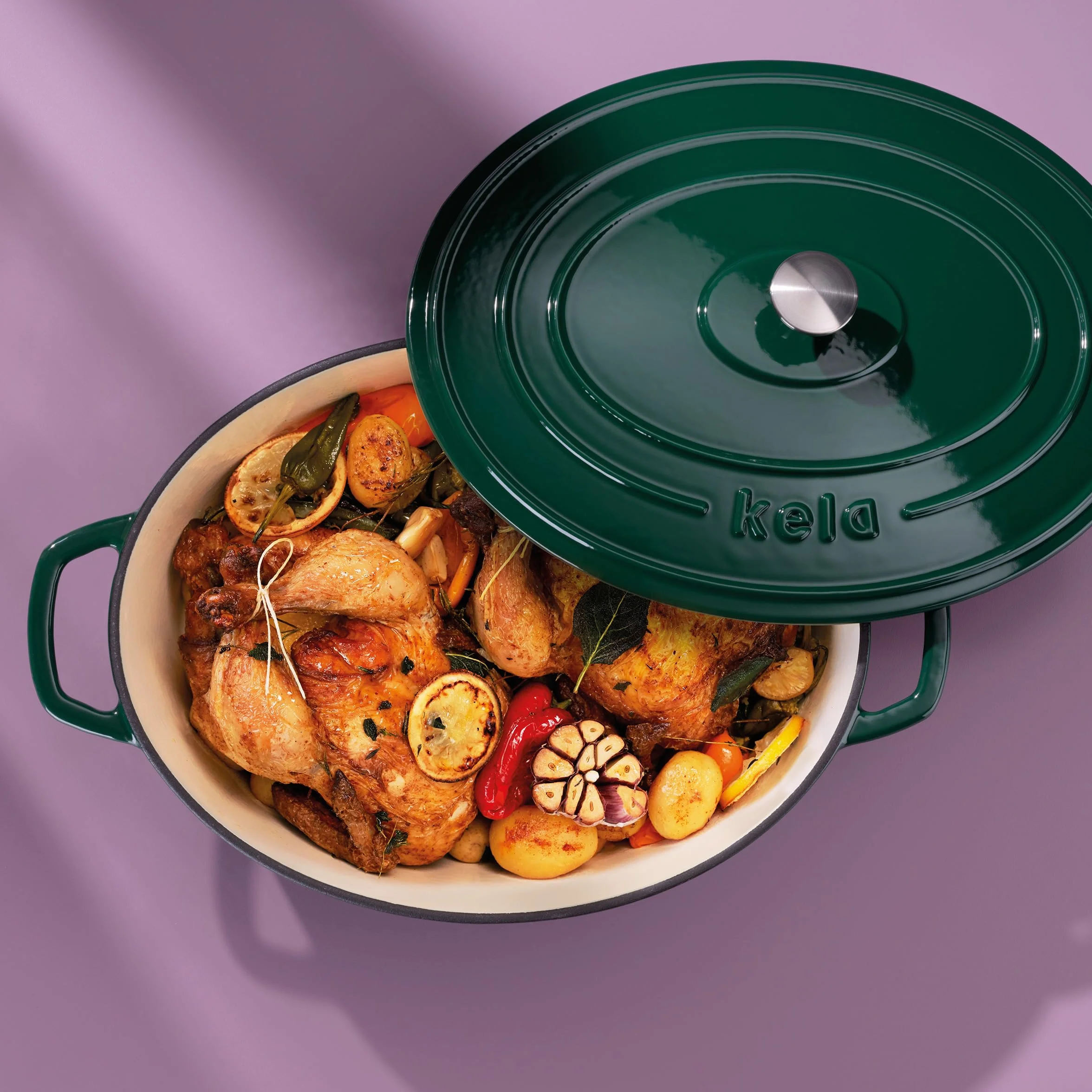 kela Garnek żeliwny owalny 9,3 litra, Dutch Oven CALIDO, indukcyjna brytfanna żeliwna z pokrywką, żeliwny garnek do pieczenia chleba, emaliowany, zielony